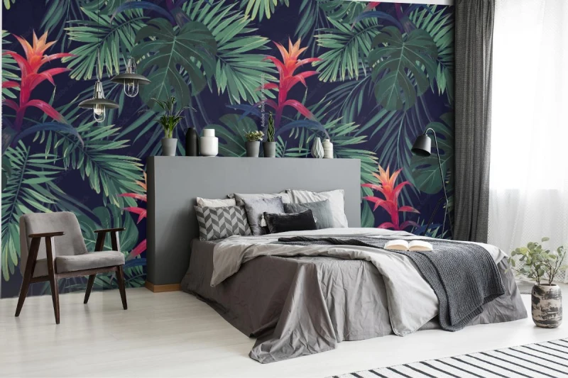 fototapeta czerwone kwiaty guzmania z liscmi palm krolewskich