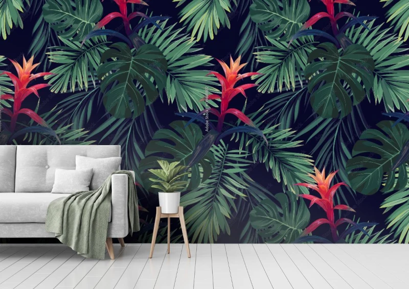 fototapeta czerwone kwiaty guzmania z liscmi palm krolewskich