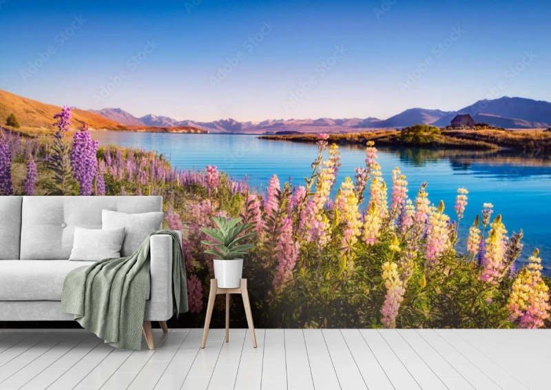 fototapeta krajobrazowy widok na jezioro tekapo i kwiaty w